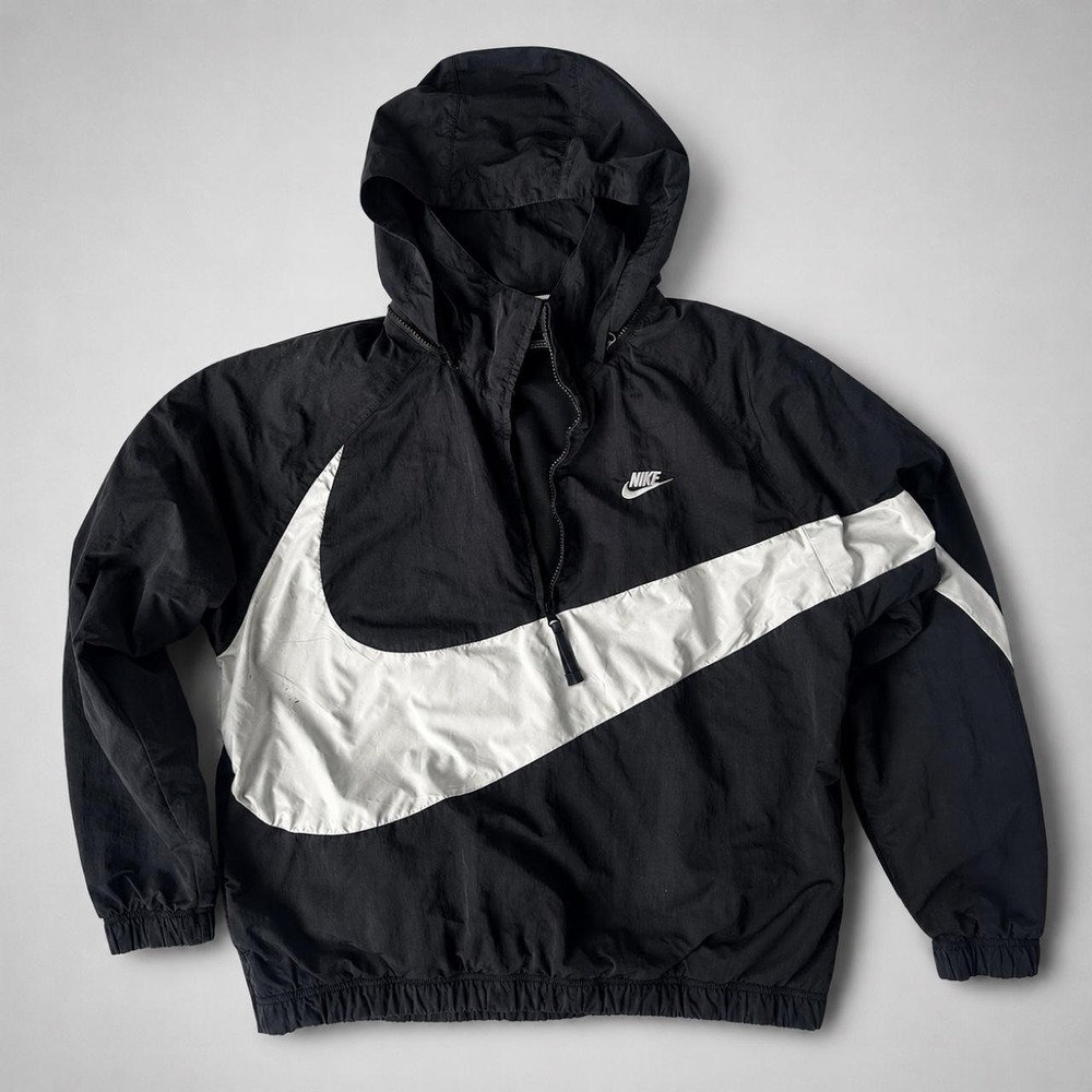 Nike black windbreaker anorak jacket with big white center swoosh. Size M